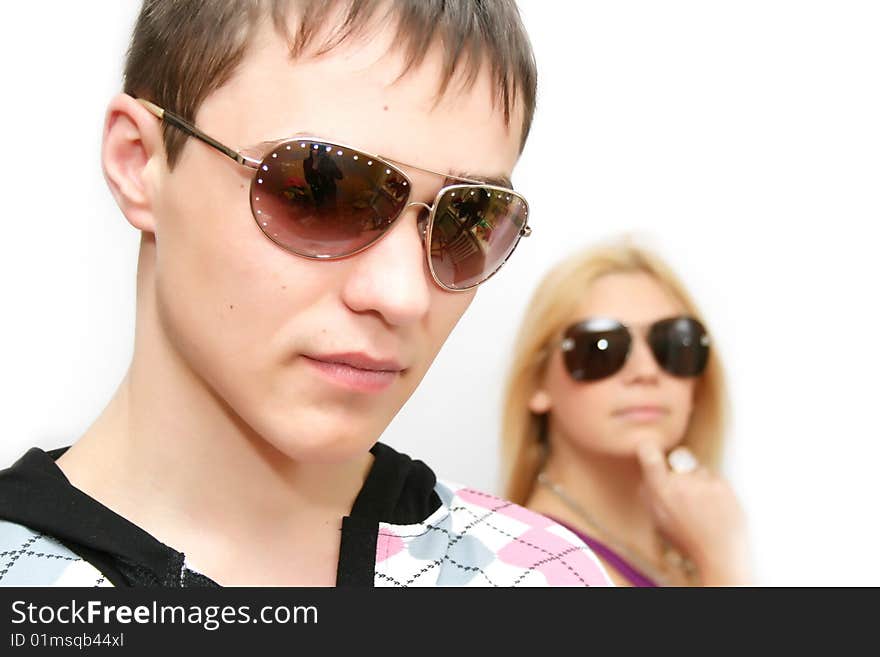 Fashionable girl and the boy on a white background