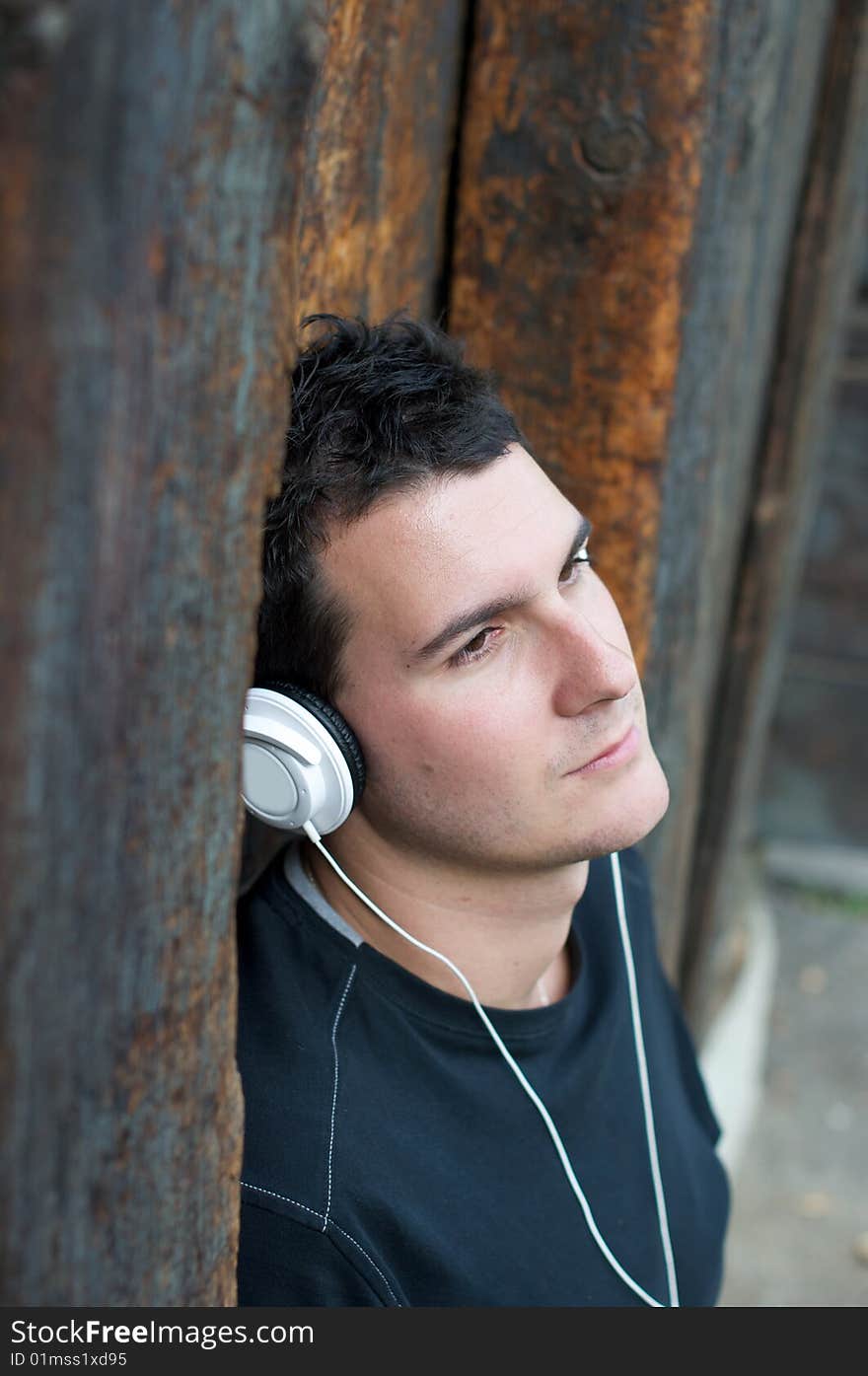 A young man listening to music. A young man listening to music