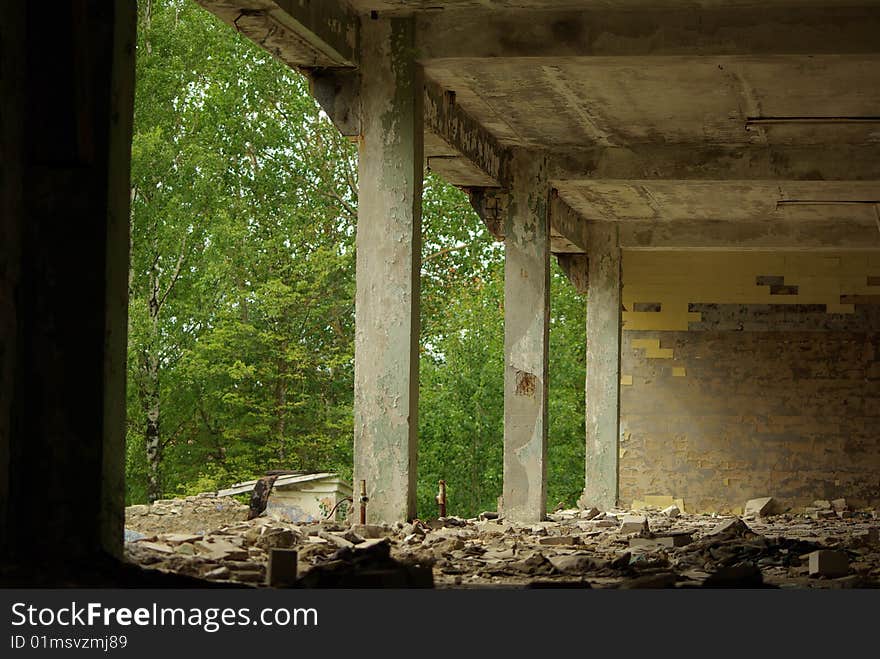 Apartment building in ruins near forest