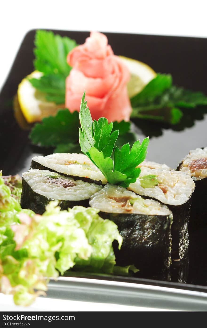 Japanese Cuisine - Sushi with Salad Leaf and Parsley