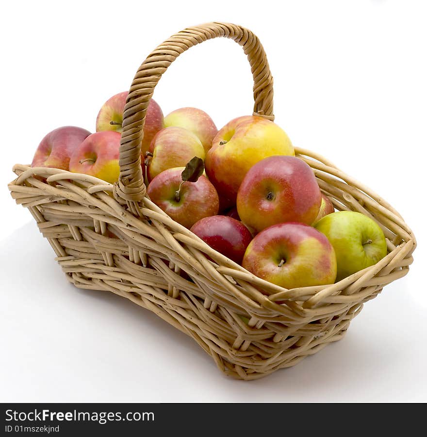 Basket with  apples  isolated on a white background