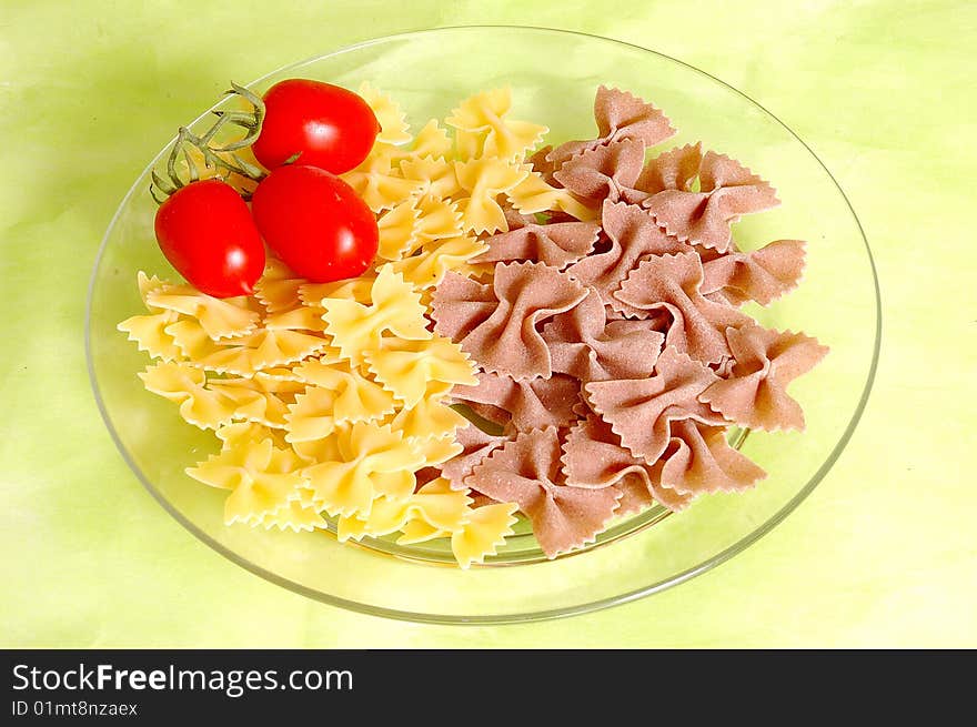 Butterfly raw whole wheat pasta and tomato. Butterfly raw whole wheat pasta and tomato