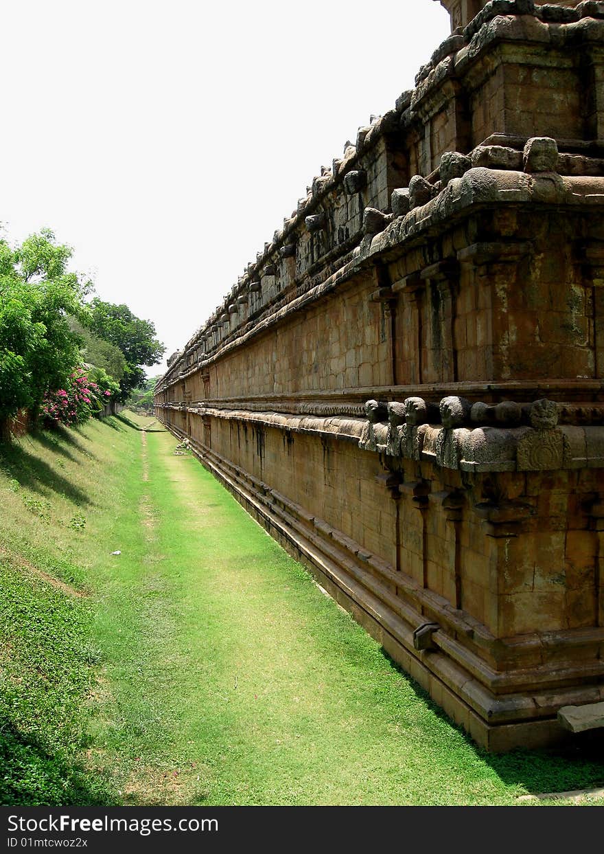 This is a large temple wall that is built of stones during the Chola period of ruling in Tanjavore of Tamil Nadu, India. This is a large temple wall that is built of stones during the Chola period of ruling in Tanjavore of Tamil Nadu, India.