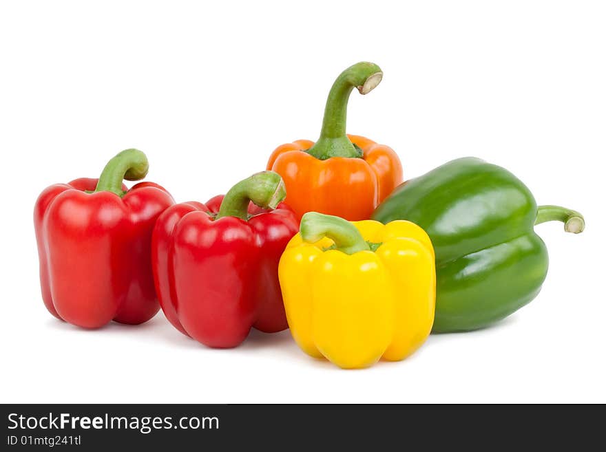 Green, yellow, orange and red paprika, isolated on white background with shadow