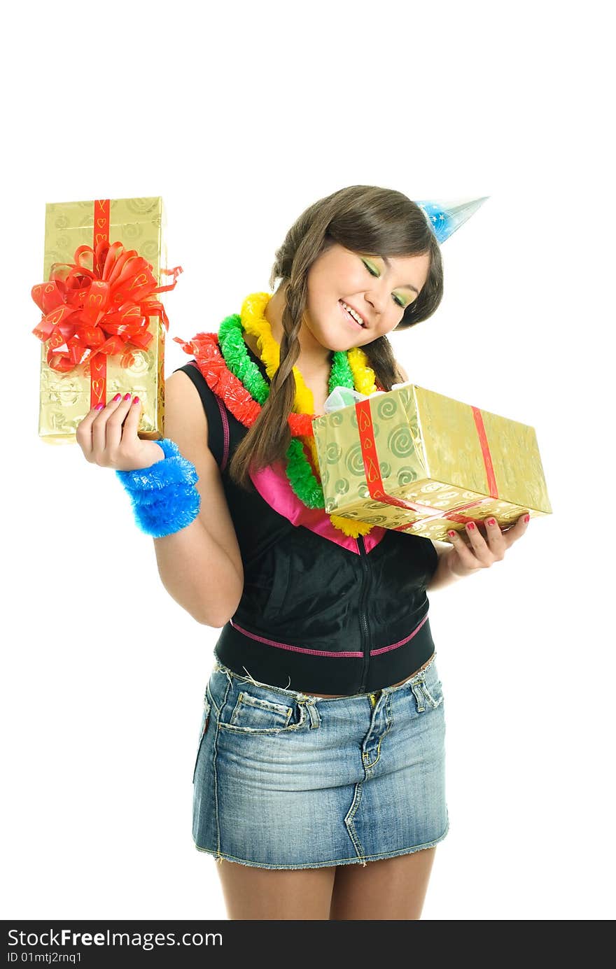 Happy young beautiful girl with a present in her hands celebrating her birthday. Happy young beautiful girl with a present in her hands celebrating her birthday