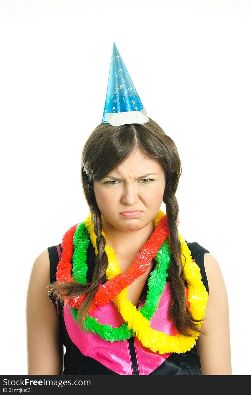 Portrait of an unhappy brunette teenage girl celebrating her birthday. Portrait of an unhappy brunette teenage girl celebrating her birthday