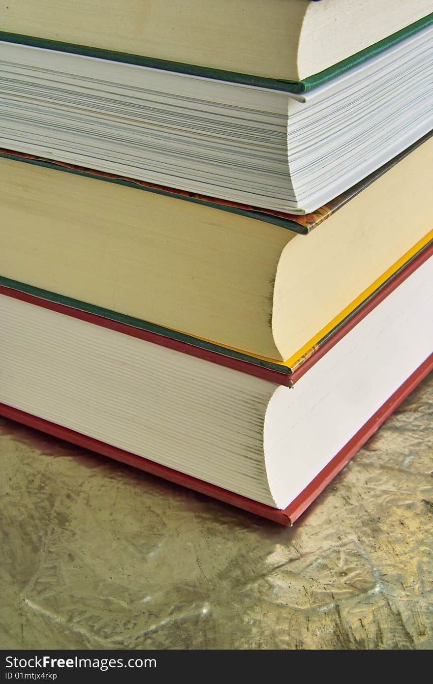 Pile of Books at a Table