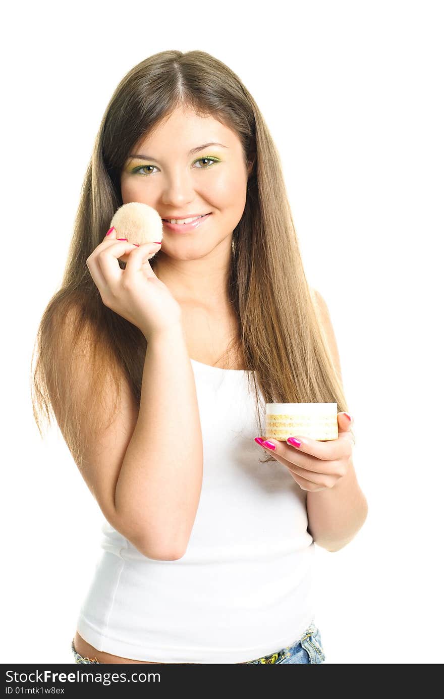 Woman applying powder with a sponge