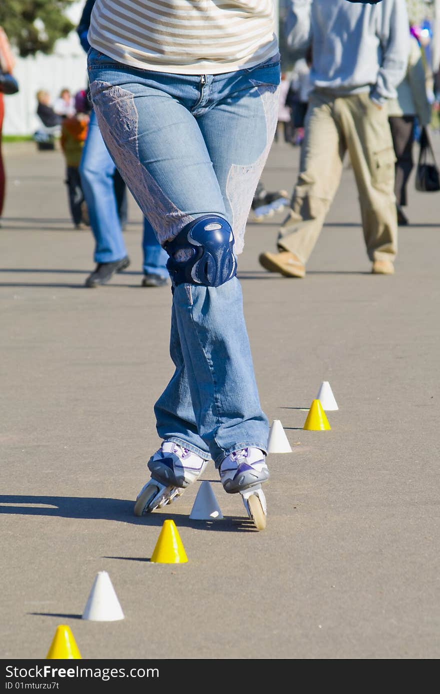 The executes the elements of the figure skating on roller skates. The executes the elements of the figure skating on roller skates.