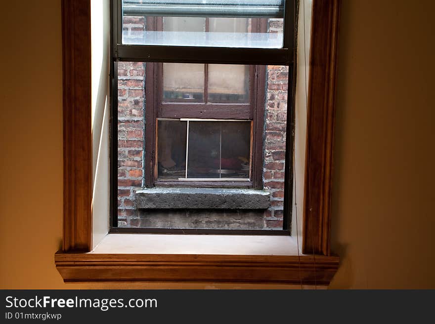 View from a window in a city apartment, of another window three feet away. View from a window in a city apartment, of another window three feet away.