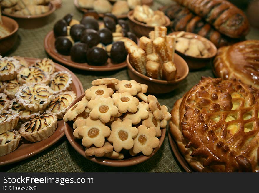 A lot of tasty cookies laying in plates. A lot of tasty cookies laying in plates