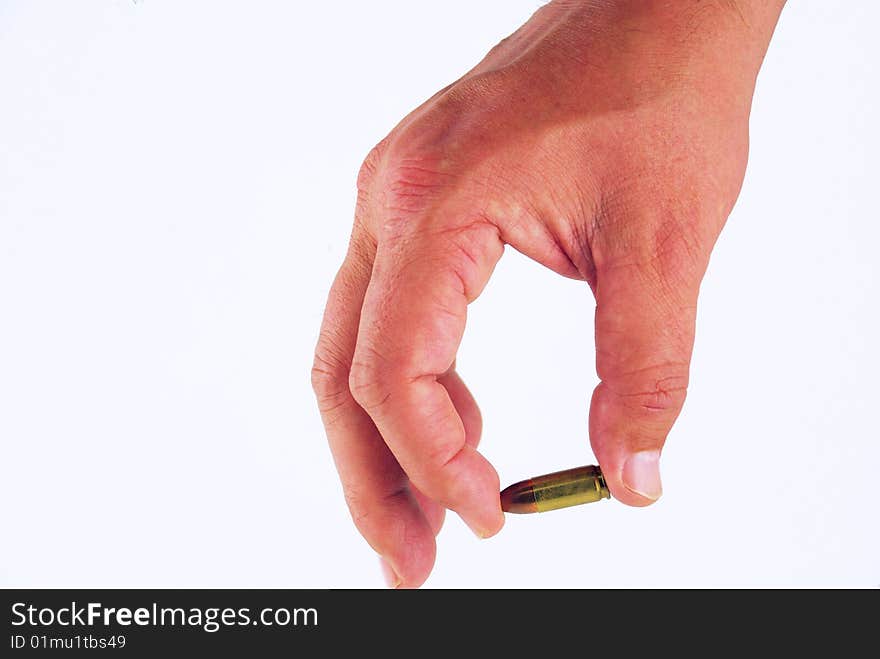 A man's hand holding a bullet