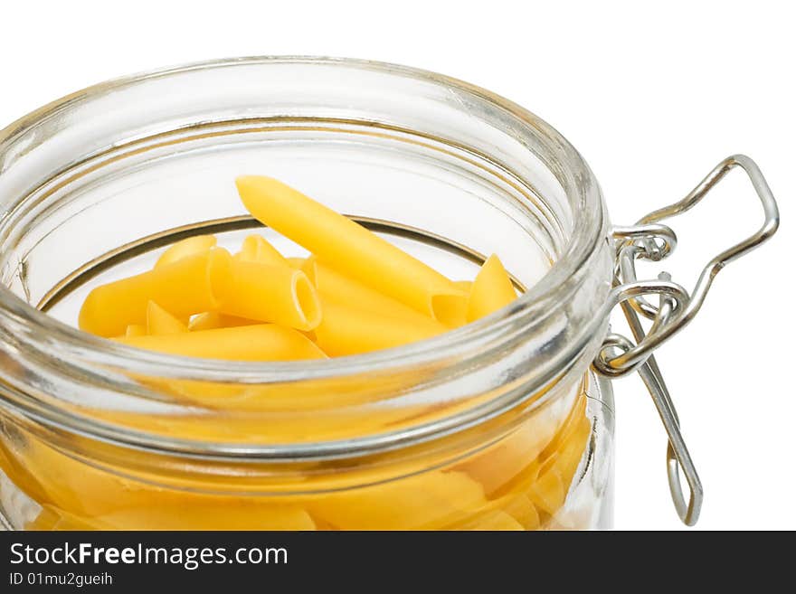 Pasta in glass can on a white background