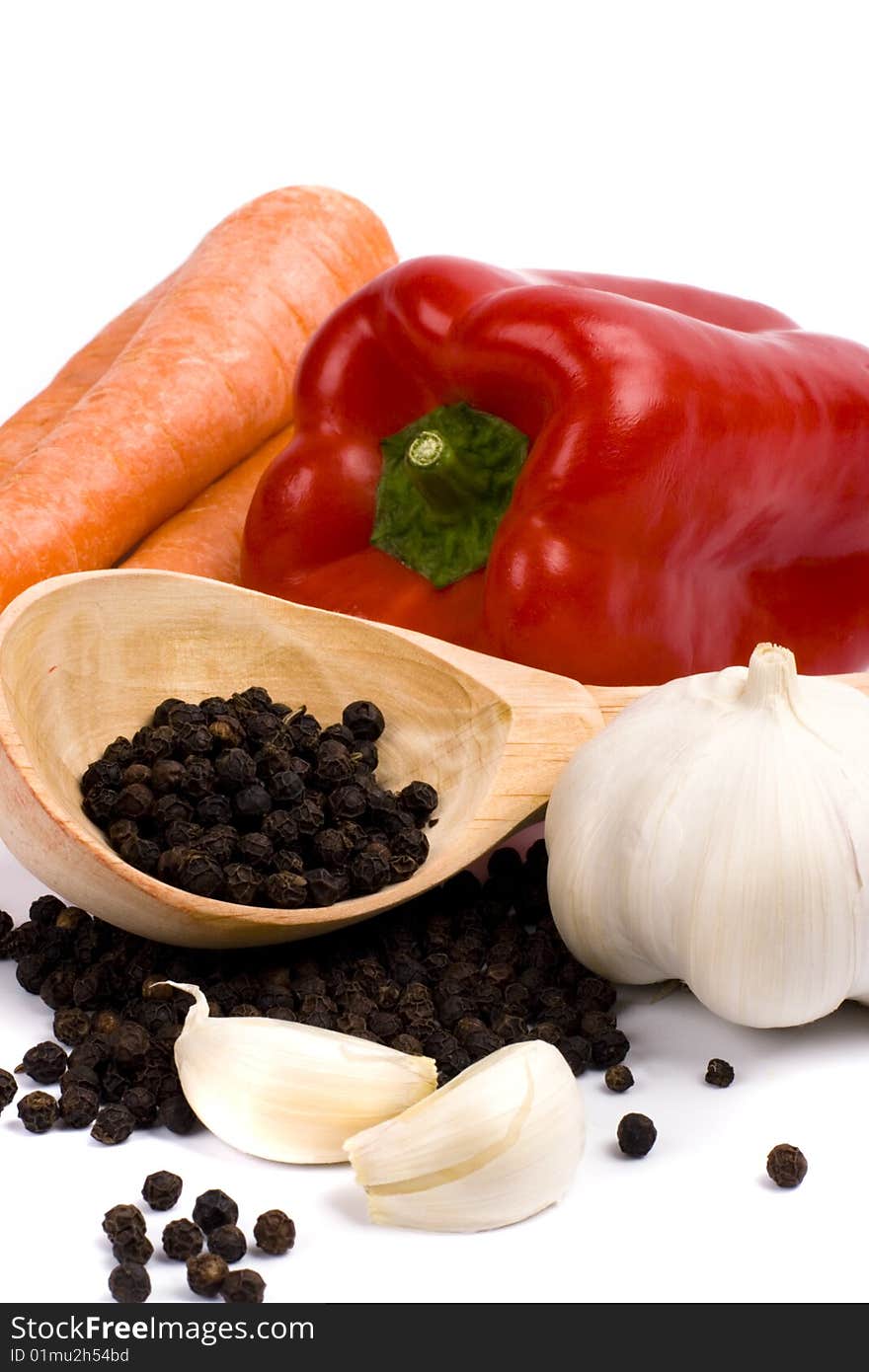 Carrots, red paprica, garlic and black pepper closeup. Carrots, red paprica, garlic and black pepper closeup