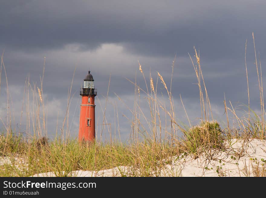 Ponce Inlet Lighthouse stands guard  near the sand south of Daytona Beach, Florida