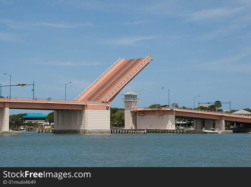 A bascule bridge on the Intracoastal Waterway opens to allow a boat through. A bascule bridge on the Intracoastal Waterway opens to allow a boat through