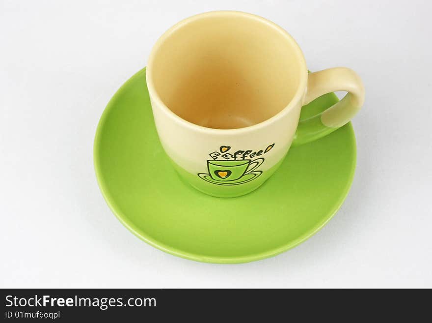 The green coffee cup is in white background