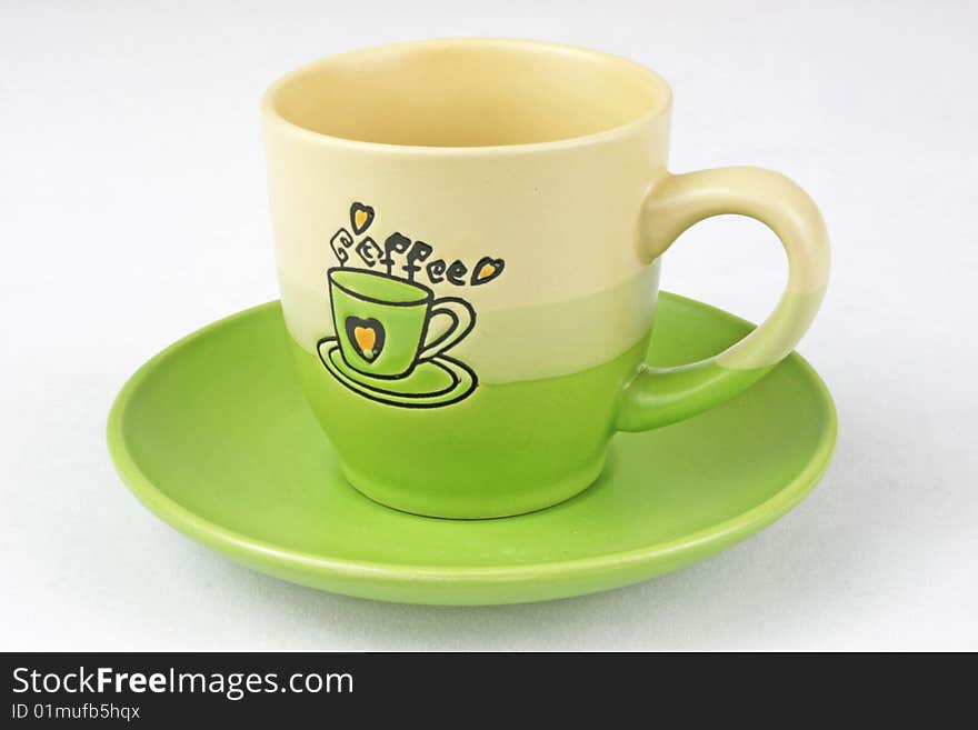 The green coffee cup is in white background