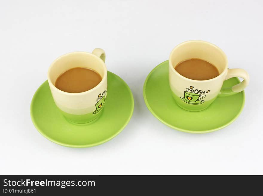 The green coffee cup is in white background