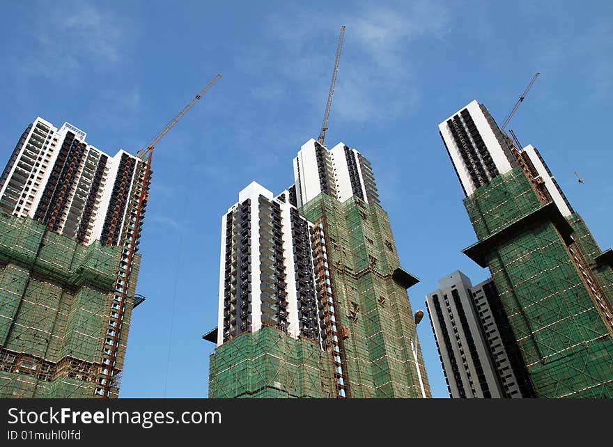 Apartment Buildings in Construction over blue sky