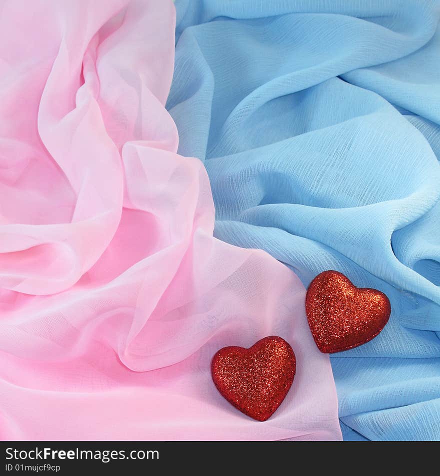 Two hearts on a silk fabric