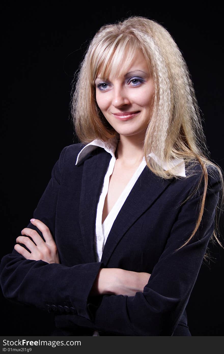 Nice girl in a business suit on a black background. Nice girl in a business suit on a black background