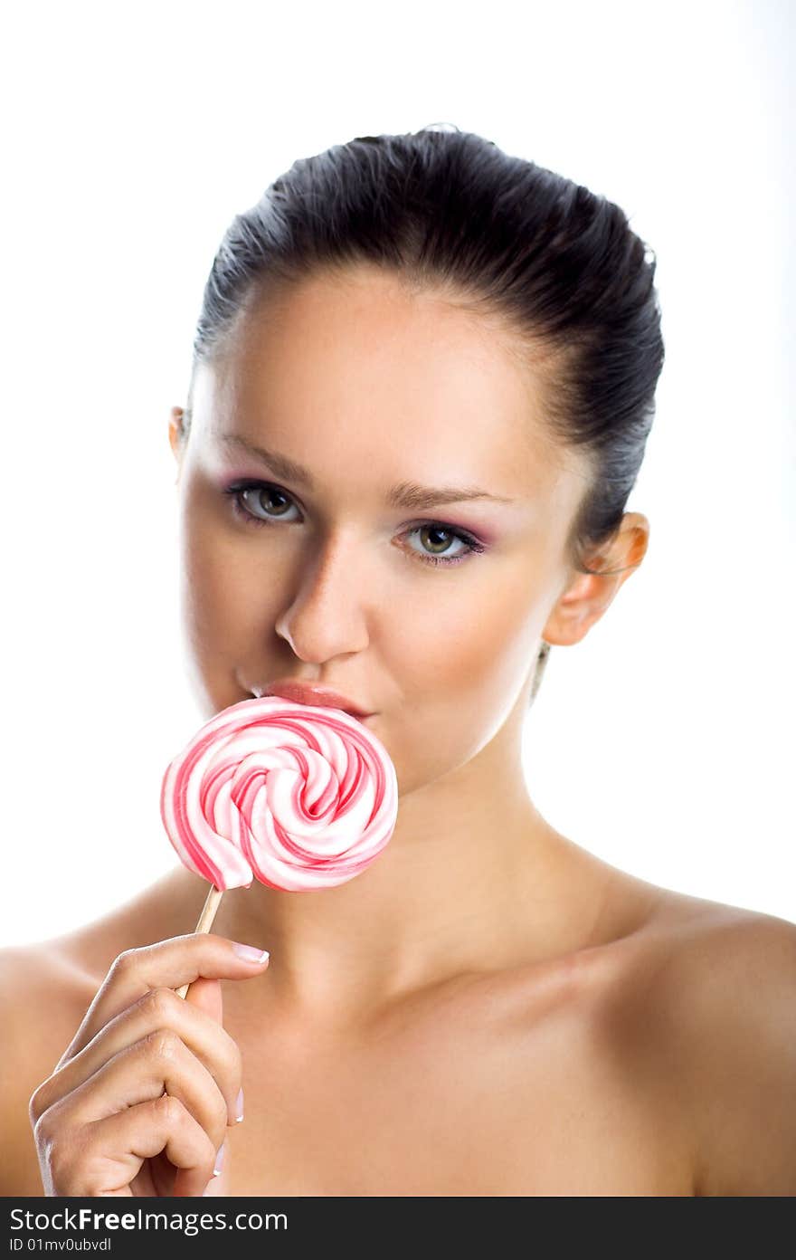 Beauty portrait of a young woman with a lollipop. Beauty portrait of a young woman with a lollipop