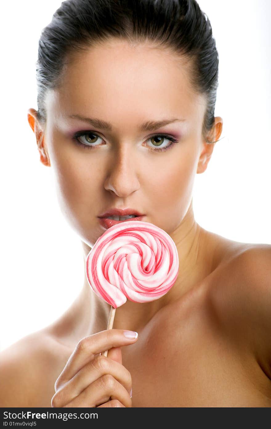 Smiling woman with a lollipop