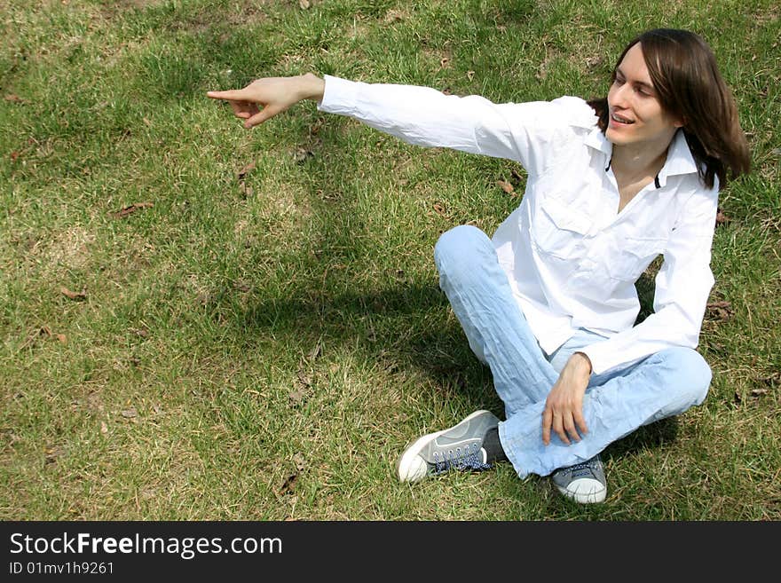 Man sitting on grass in a park