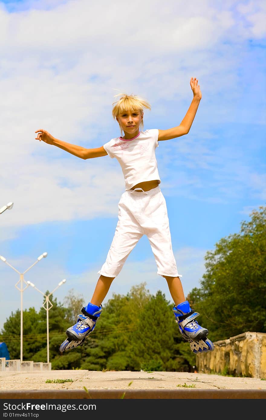 Jump on roller skates. Little girl. Jump on roller skates. Little girl