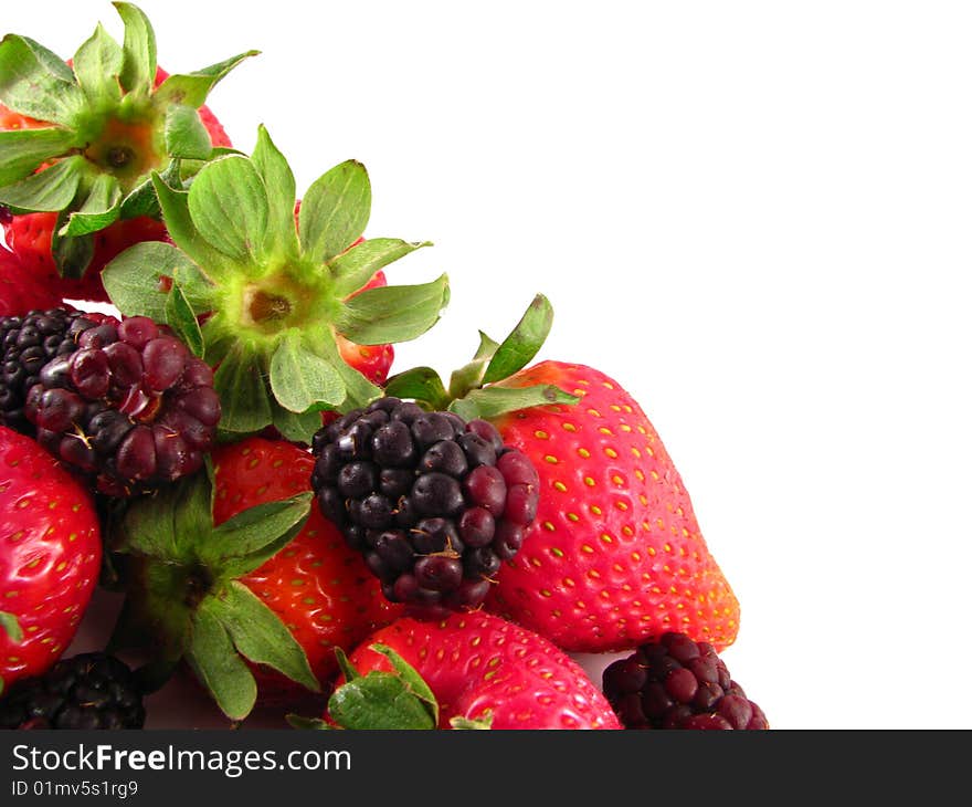 An arrangement of strawberries and blackberries on a white background. An arrangement of strawberries and blackberries on a white background