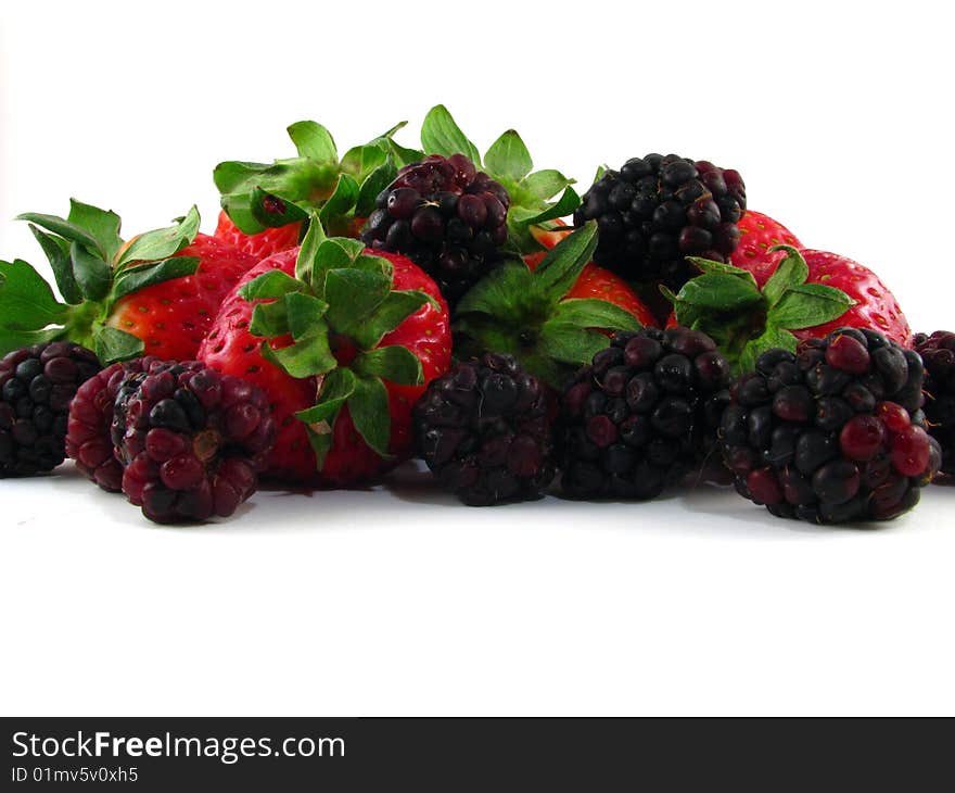 An arrangement of strawberries and blackberries on a white background. An arrangement of strawberries and blackberries on a white background