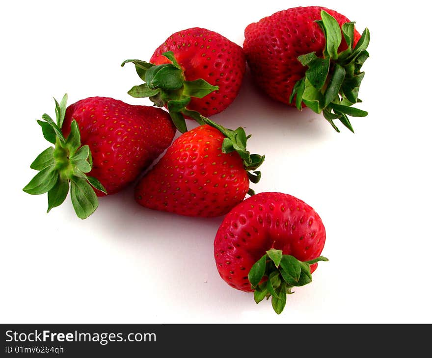 An arrangement of strawberries on a white background