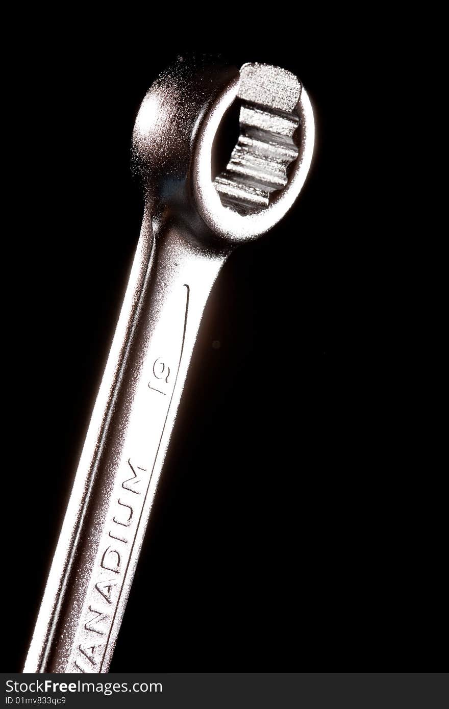 Tools series: steel wrench on black background