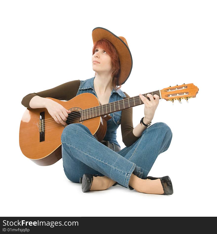 Woman sitting on a floor and playing guitar. Woman sitting on a floor and playing guitar