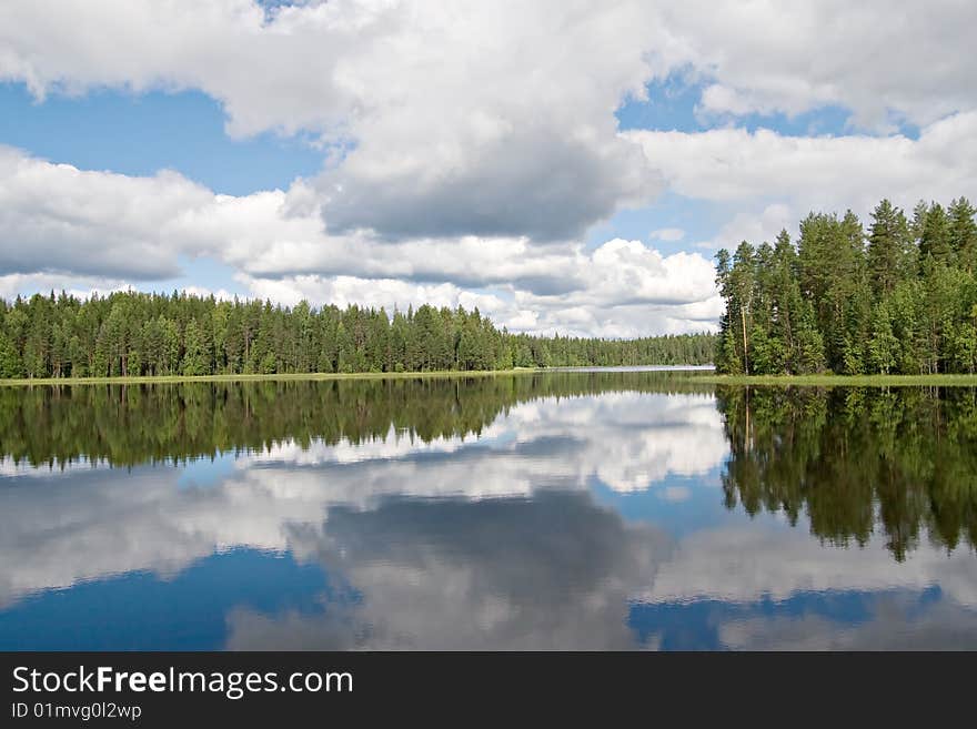 Landscape of Karelian lake and sky with clouds. Landscape of Karelian lake and sky with clouds