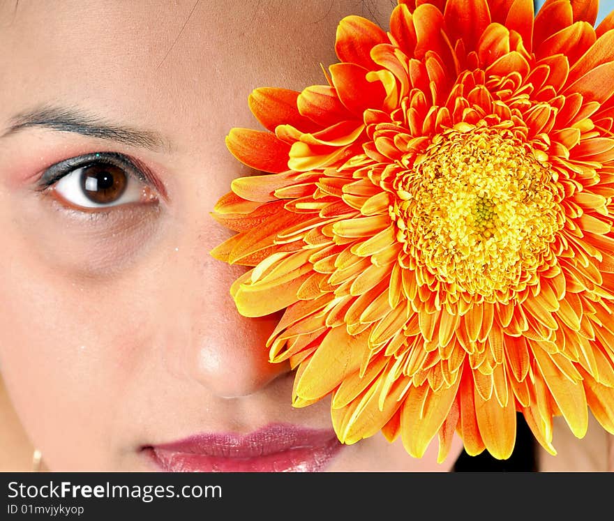 Indian girl with orange flower. Indian girl with orange flower.