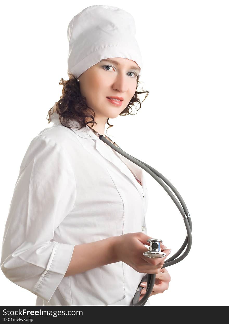 Doctor in a white robe and cap uniform with a stethoscope in the hands of