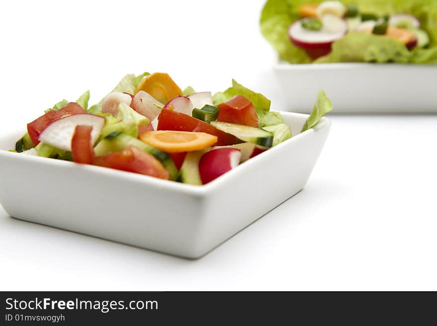 Isolated fresh salad in a white plate