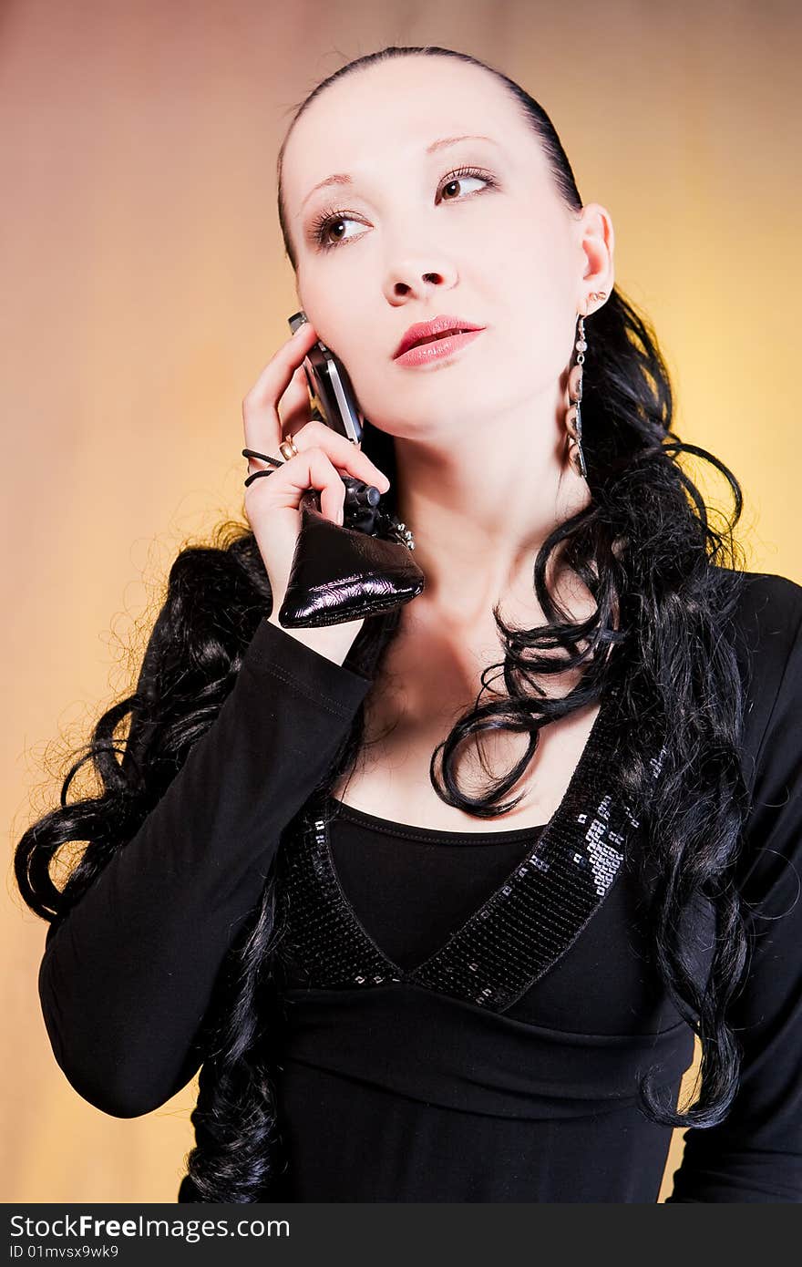 Woman speaking on phone looking aside