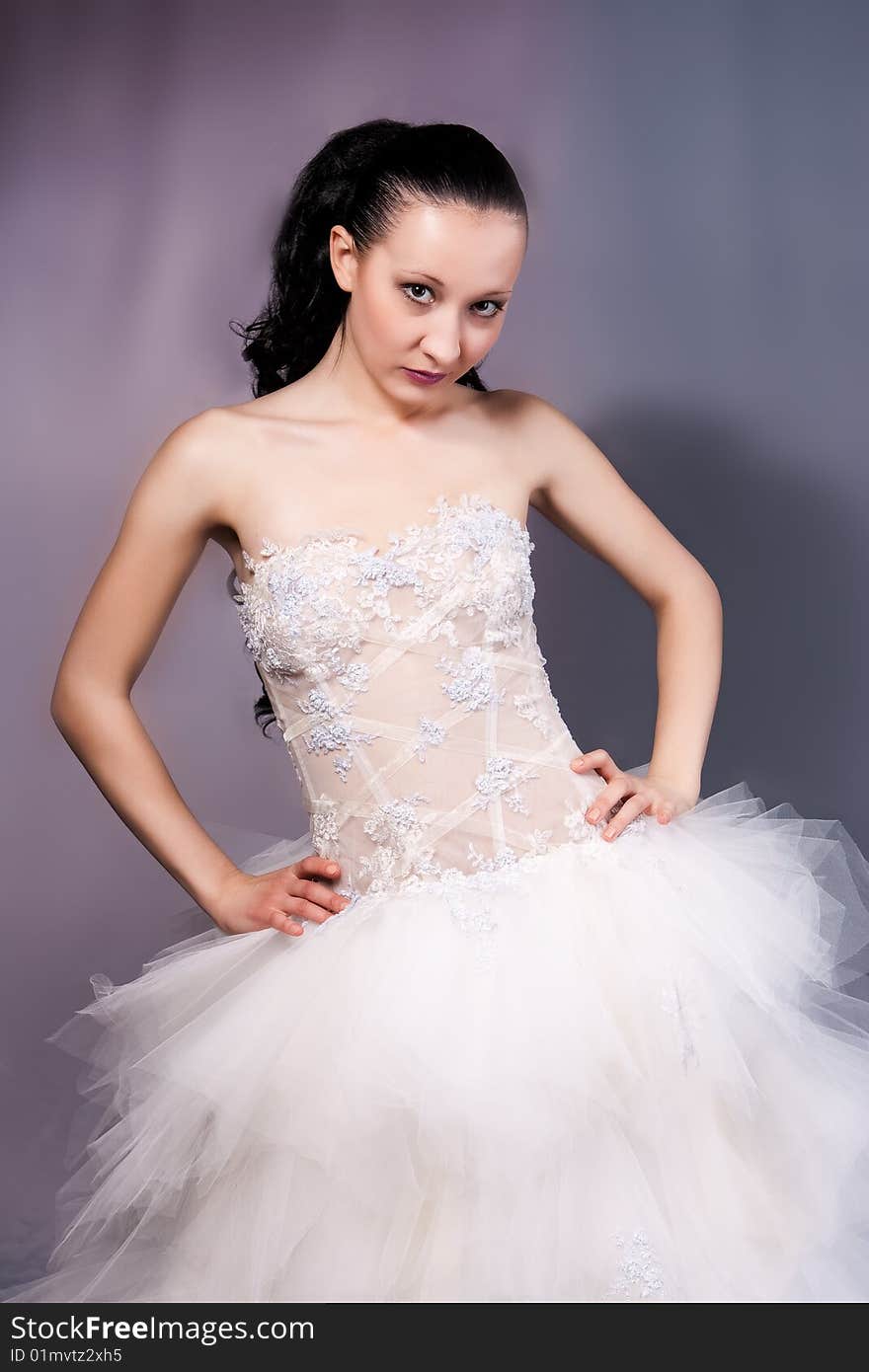 Young bride in white with serious look