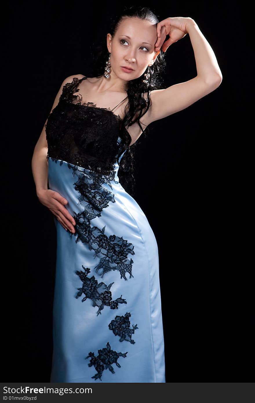 Beautiful woman in blue evening dress