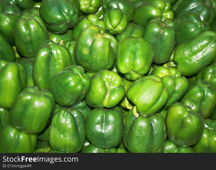 Group of green paprika bell peppers in market