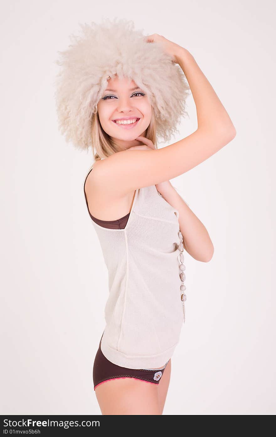 Smiling attractive girl in white hat