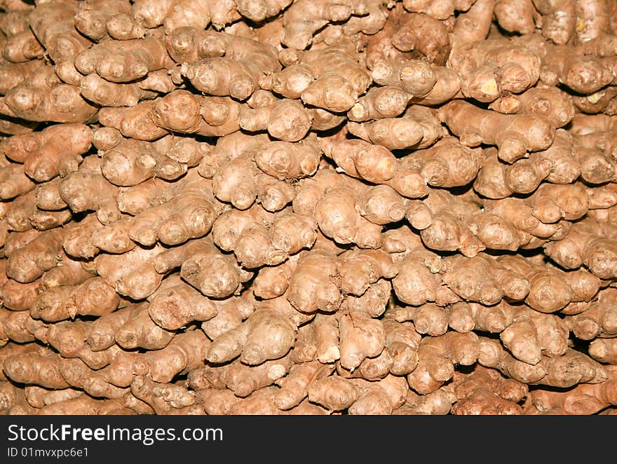 Background of dry ginger roots on the floor in India