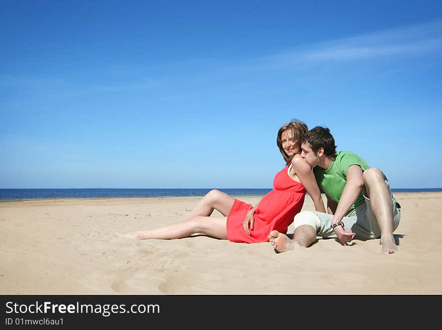 Young couple relaxing on the beach. Young couple relaxing on the beach