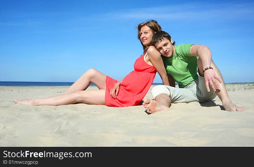 Young couple relaxing on the beach. Young couple relaxing on the beach