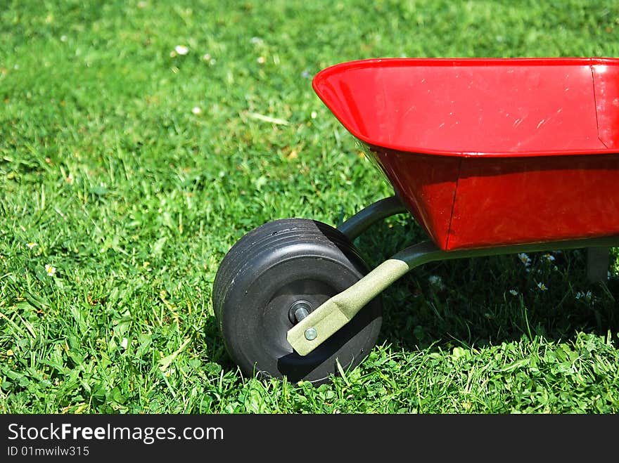 The red handbarrow in the garden.