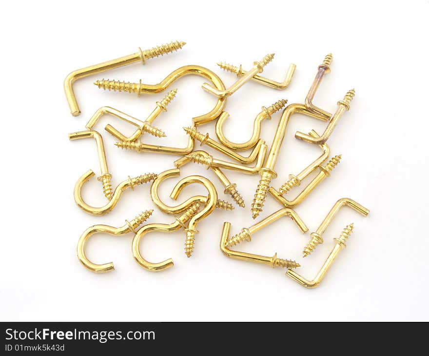 Assorted brass hookes used for hanging light objects. Assorted brass hookes used for hanging light objects.