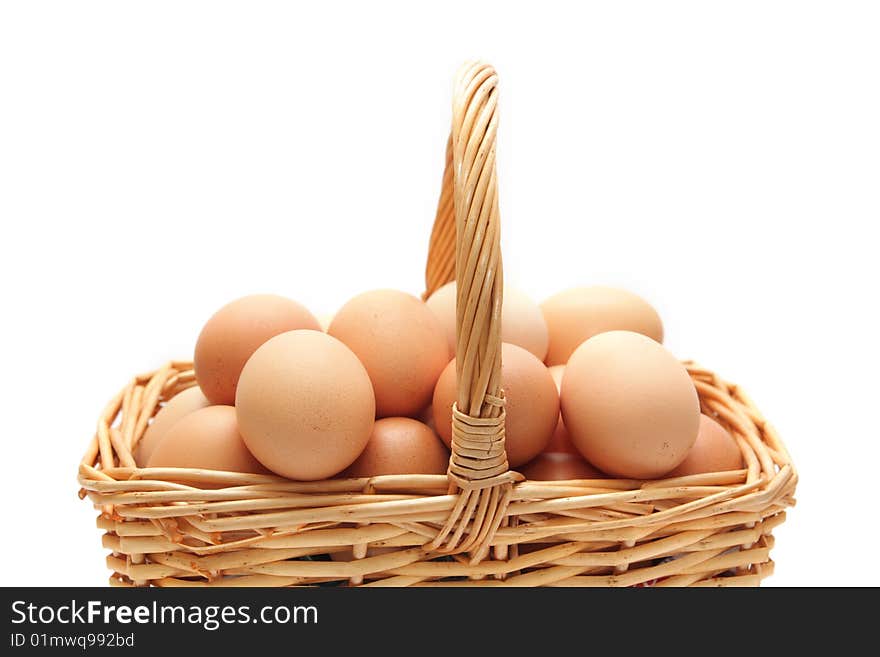 Eggs in a basket on a white background